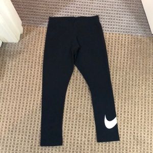 Nike cropped leggings with swoosh logo on left leg